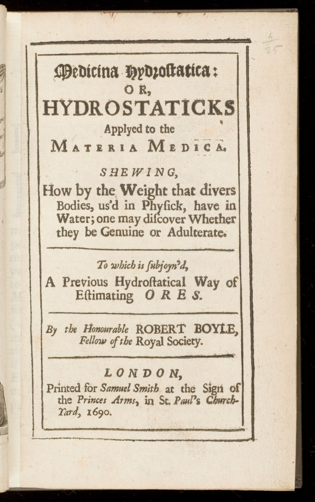 Offenes Buch mit schwarzem Hintergrund und weißer Seite, die den Titel "Medicina Hydrostatica oder Hydrostaticks angewendet auf die Materia Medica" anzeigt.